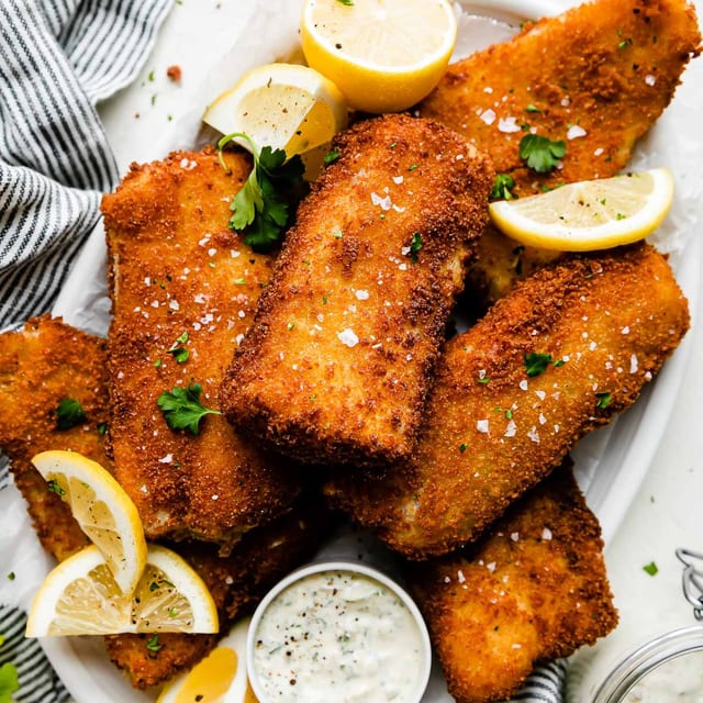 Fish Amritsari Tilapia Pleces Coated With Delictey Spice Gram Flour Batter Golden Fried.